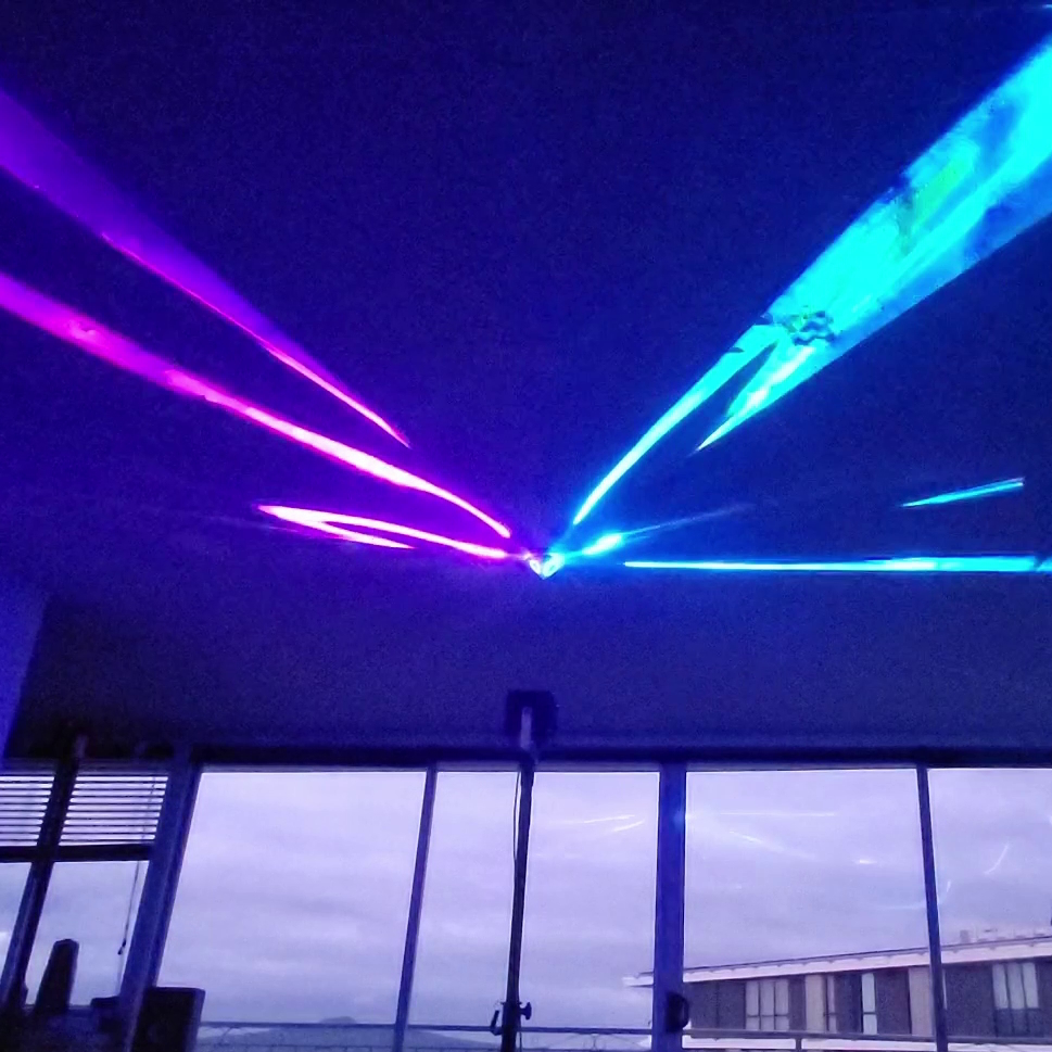 Medusa Mirror fanning a laser beam across a ceiling